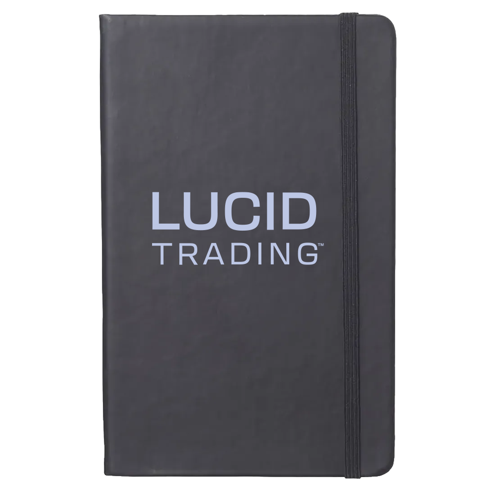 Black notebook with 'Lucid Trading' logo on a white background